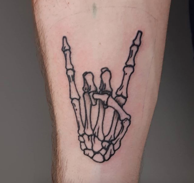 Rick_Goertzen-Sign_of_the_horn_skeleton_tattoo